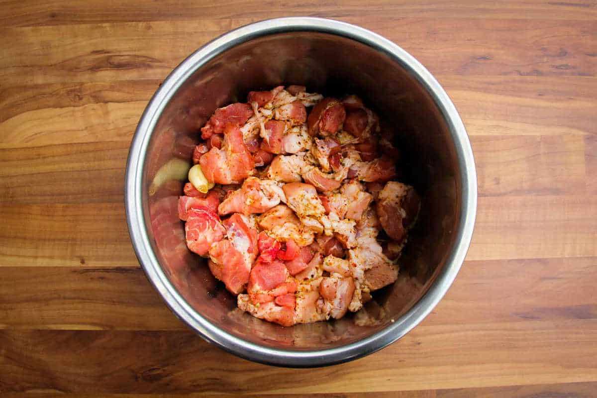 The diced pork meat in the instant pot bowl.