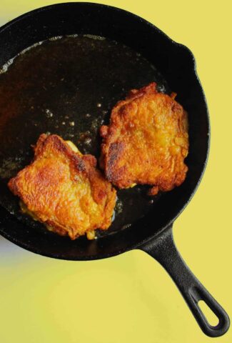 Crispy curried chicken thigh with ginger garlic spinach