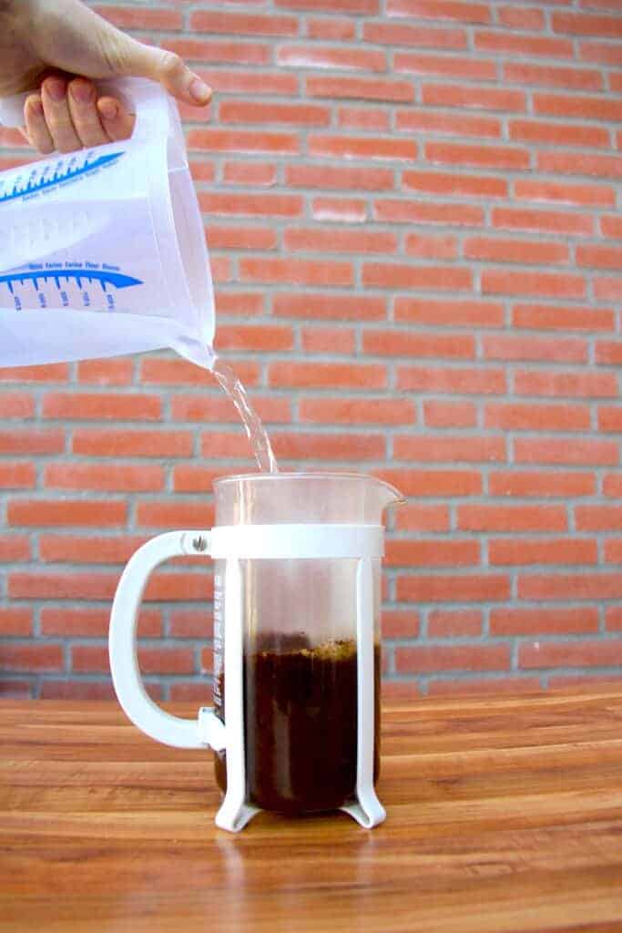 Pouring the water into the french press.