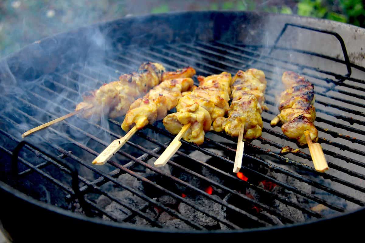 Chicken satays on the charcoal bbq.