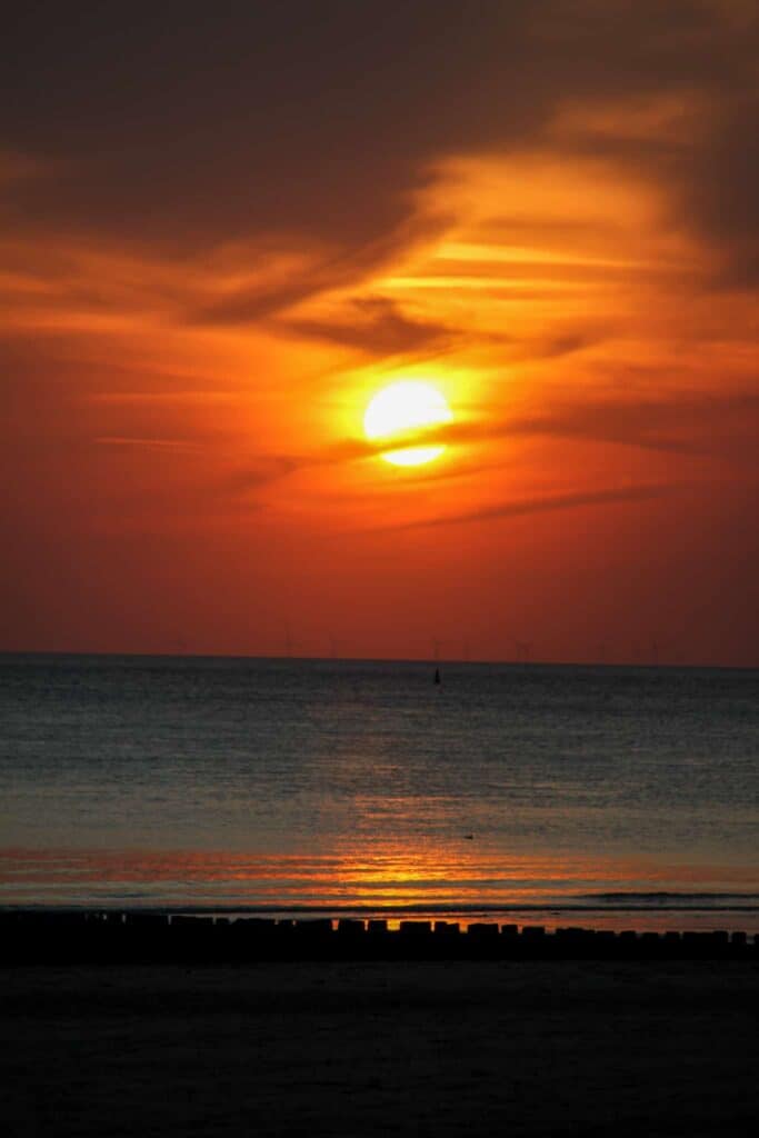 A sunset by the beach in Zeeland, the Netherlands.