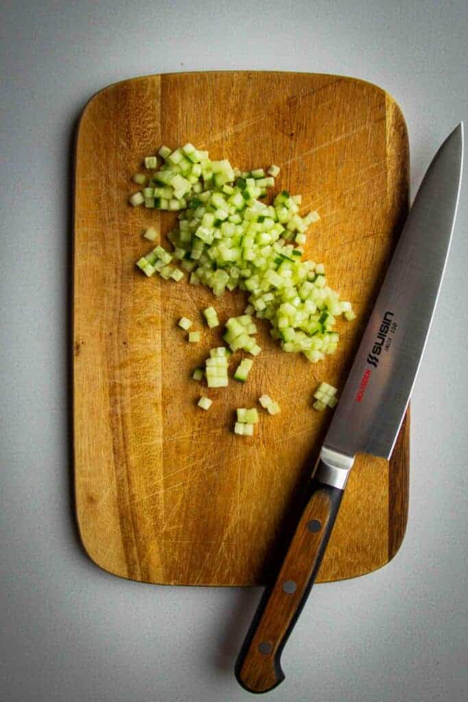 Cucumbers cut into a small brunoise dice.