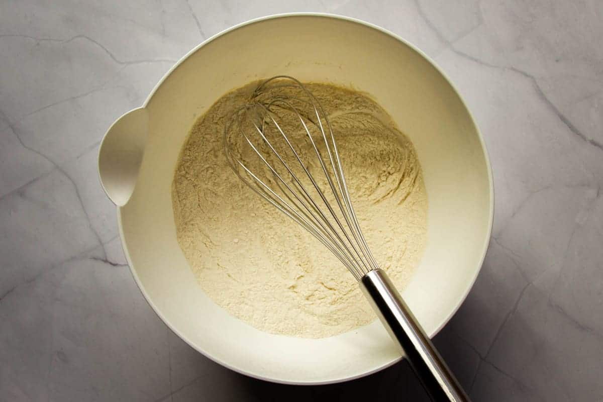 Flour and baking soda mixed in a bowl.