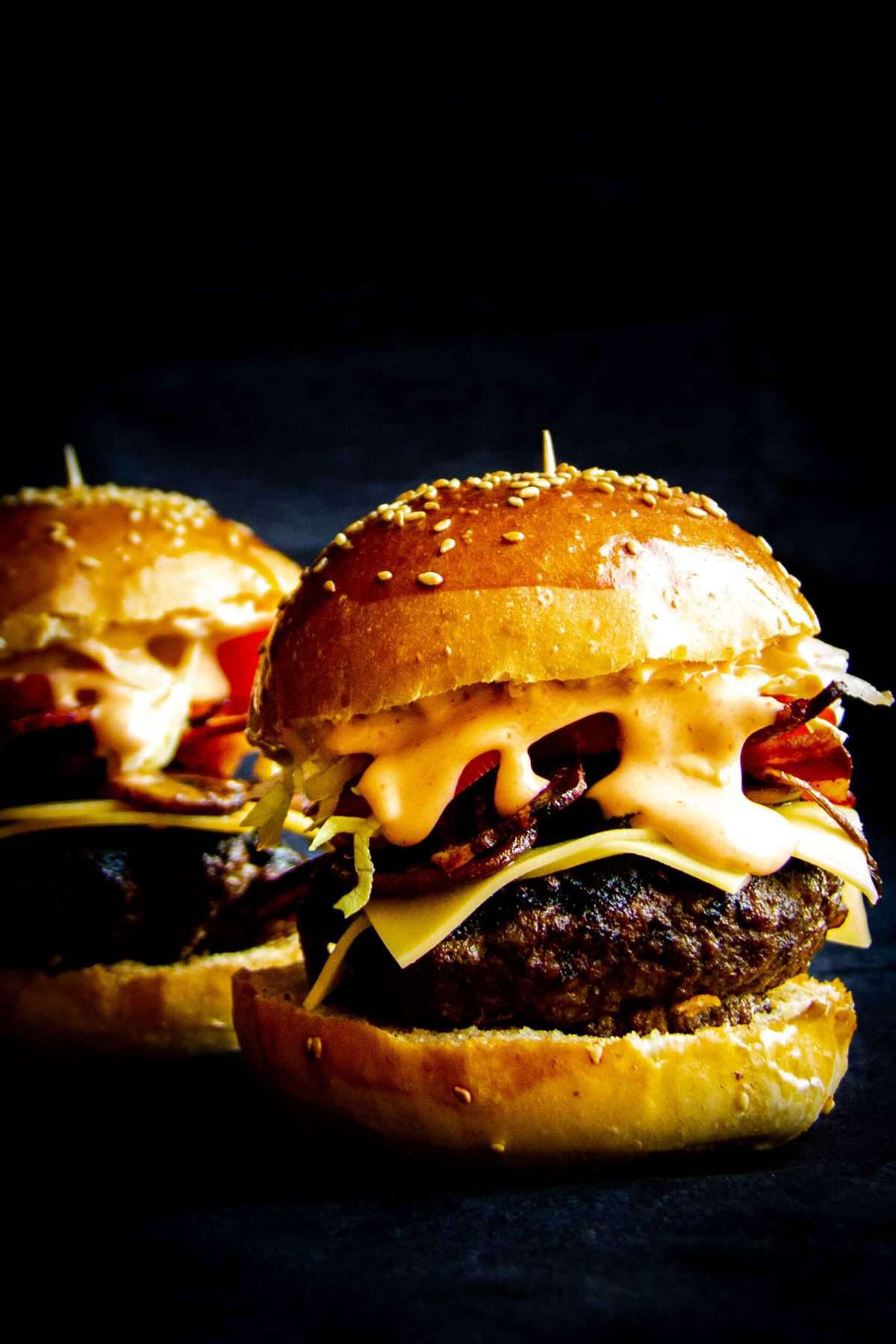 Bacon double cheese burger with lettuce, tomato, mac sauce and a home made milk bun.