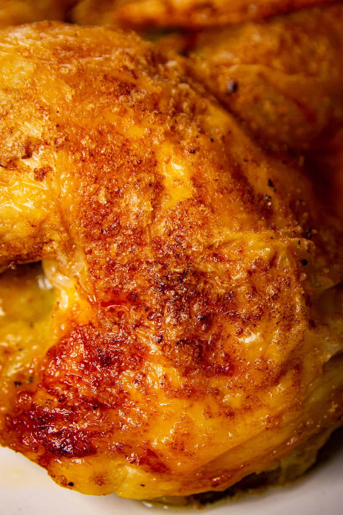 A close up of crispy chicken skin.