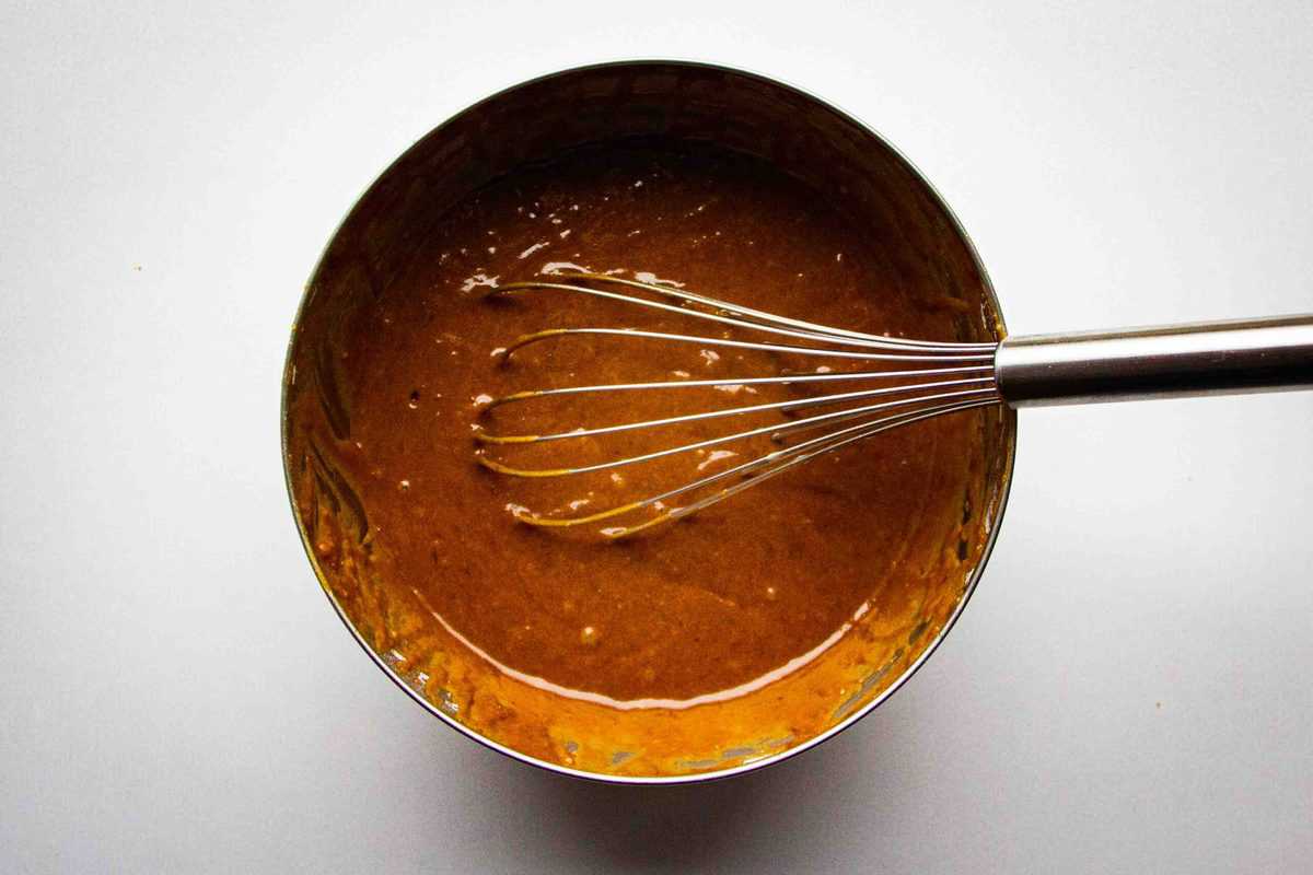 Whisking the sticky toffee bater to remove any lumps