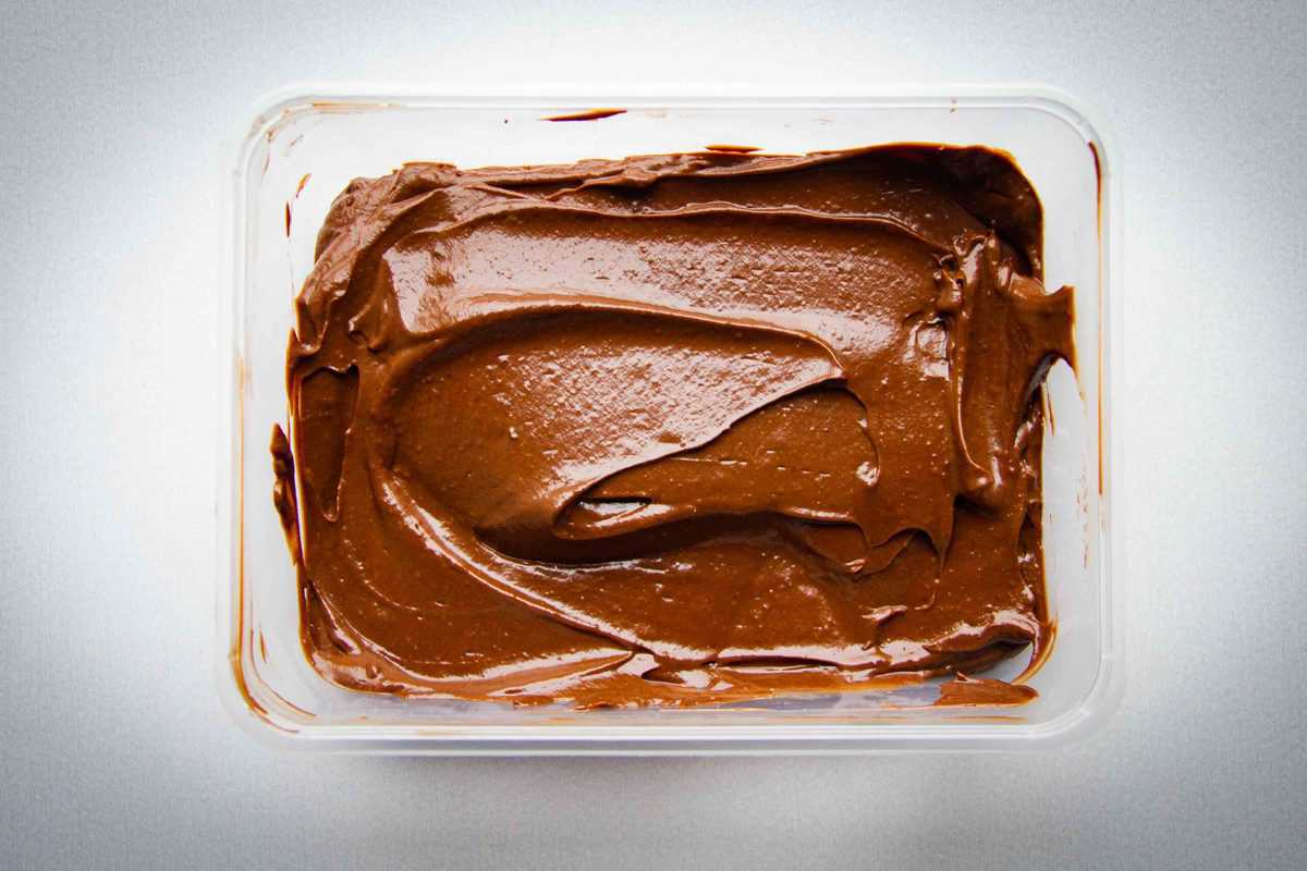Storing the mousse in a container.