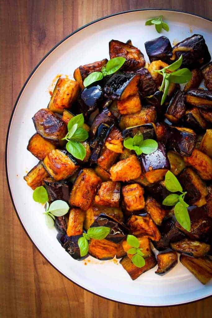 Vegan olive oil fried eggplant dish with garlic, lemon, chili and smoked paprika.