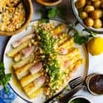 White asparagus with ham, egg, potato, chives, parsley and brown butter.