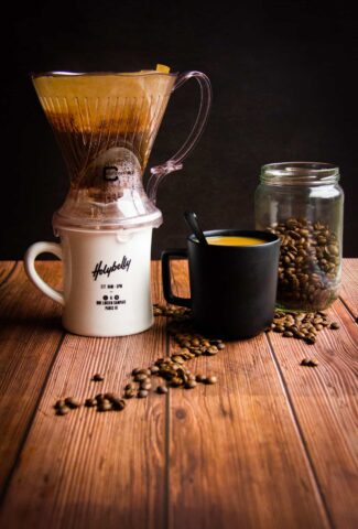 Brewing the filter coffee with coffee beans on the side.