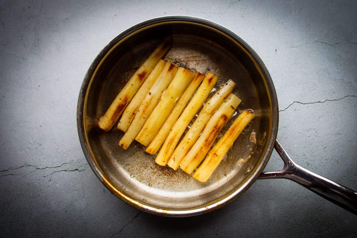 Browning the black salsify in butter.