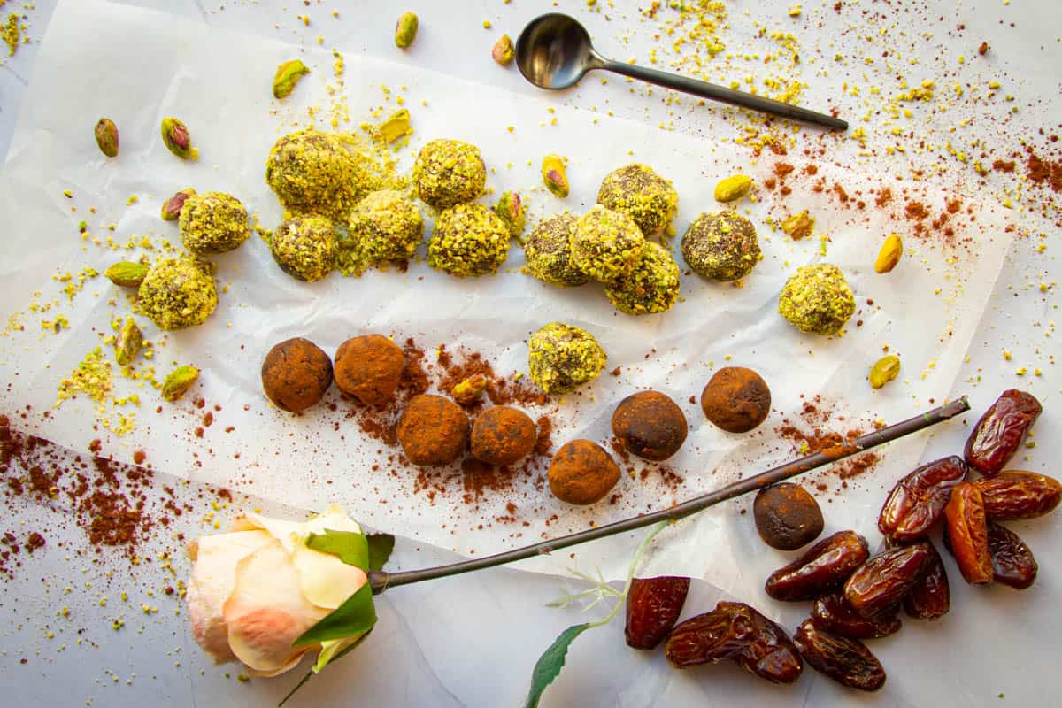 A mix of pistachio and cocoa powder dusted vegan chocolate truffles.