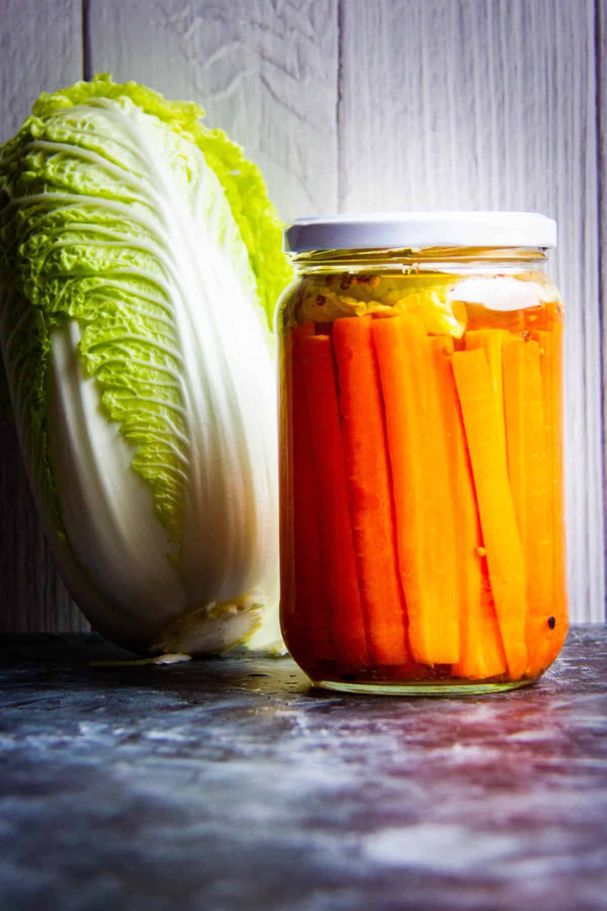 Fermented Carrots with cabbage and raw carrots on the side.