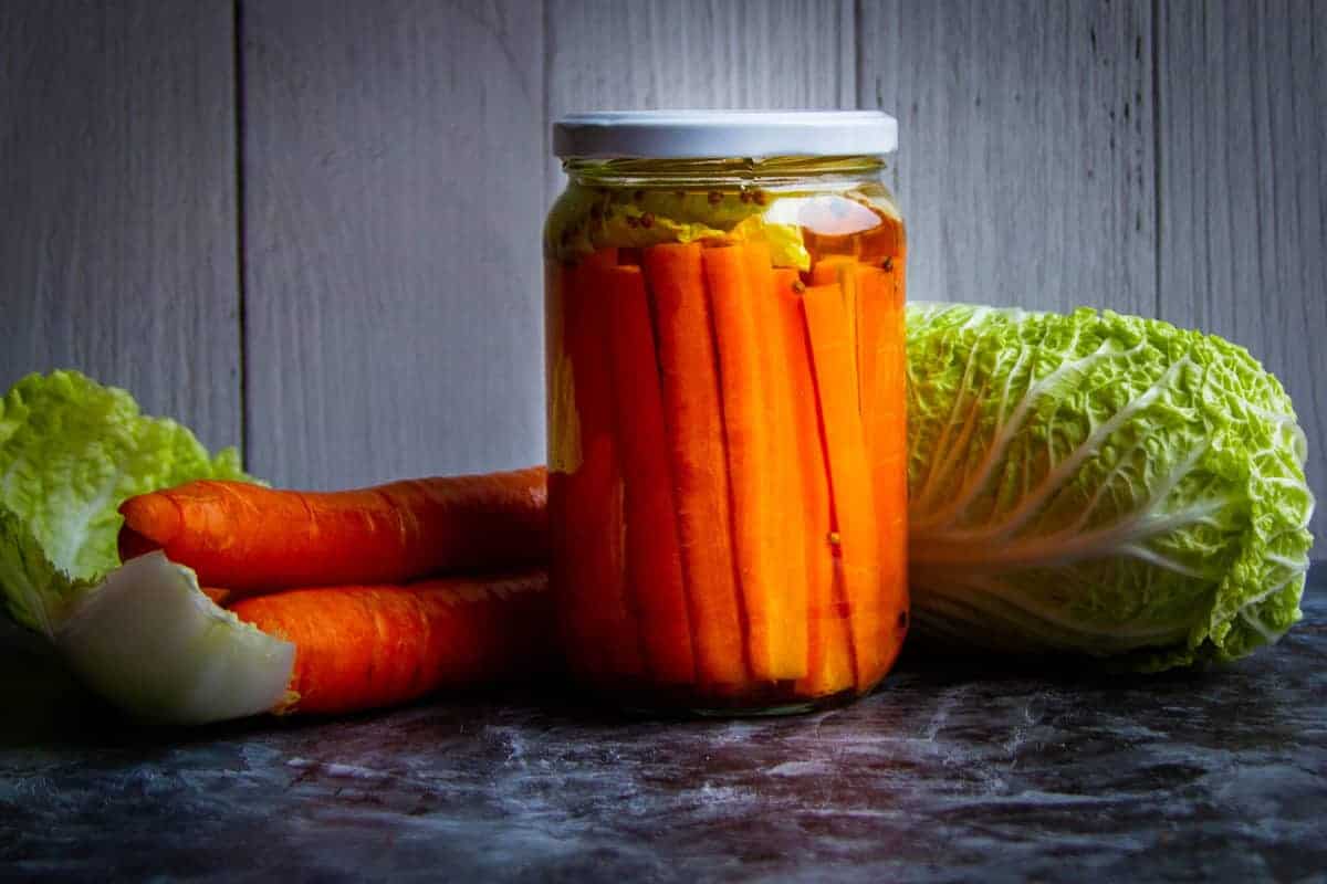 Fermented Carrots with cabbage and raw carrots on the side.