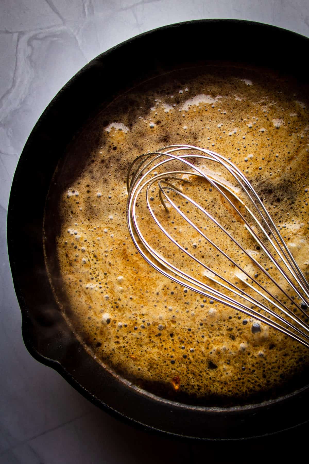 Simmering guinness sauce