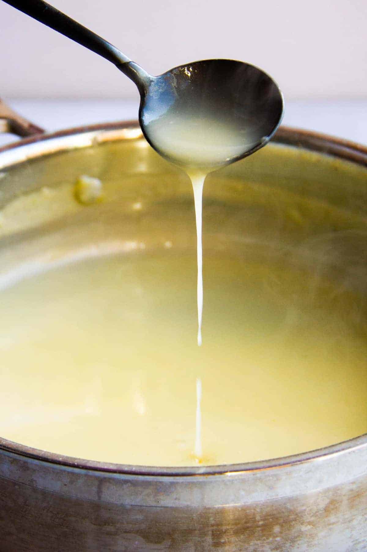 Sauce pouring in a pan.