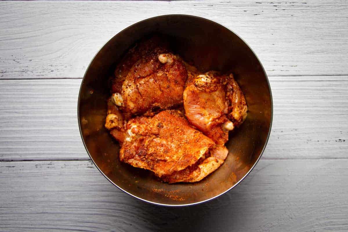rubbing-the-chicken-thighs-in-the-spice-blend