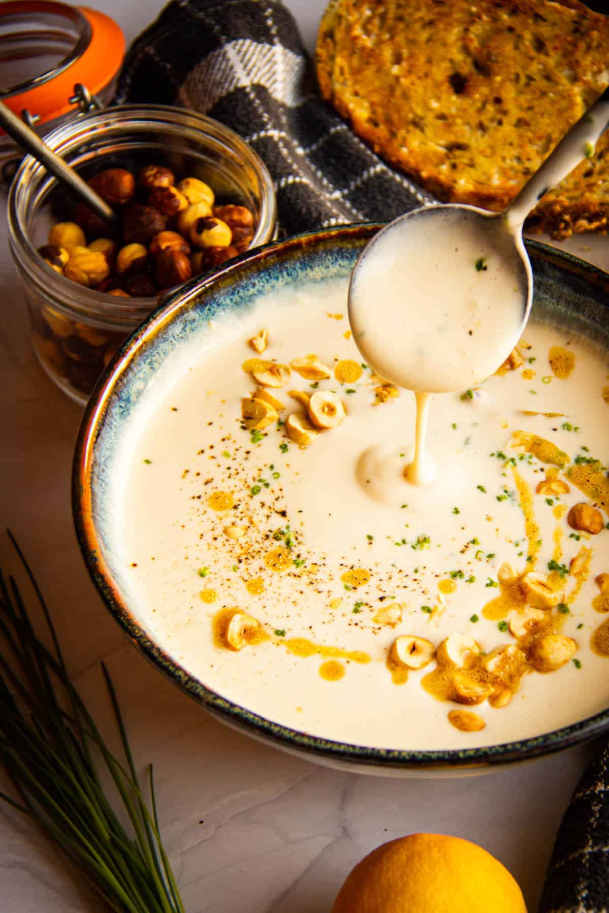 white asparagus soup with brown butter and hazelnuts