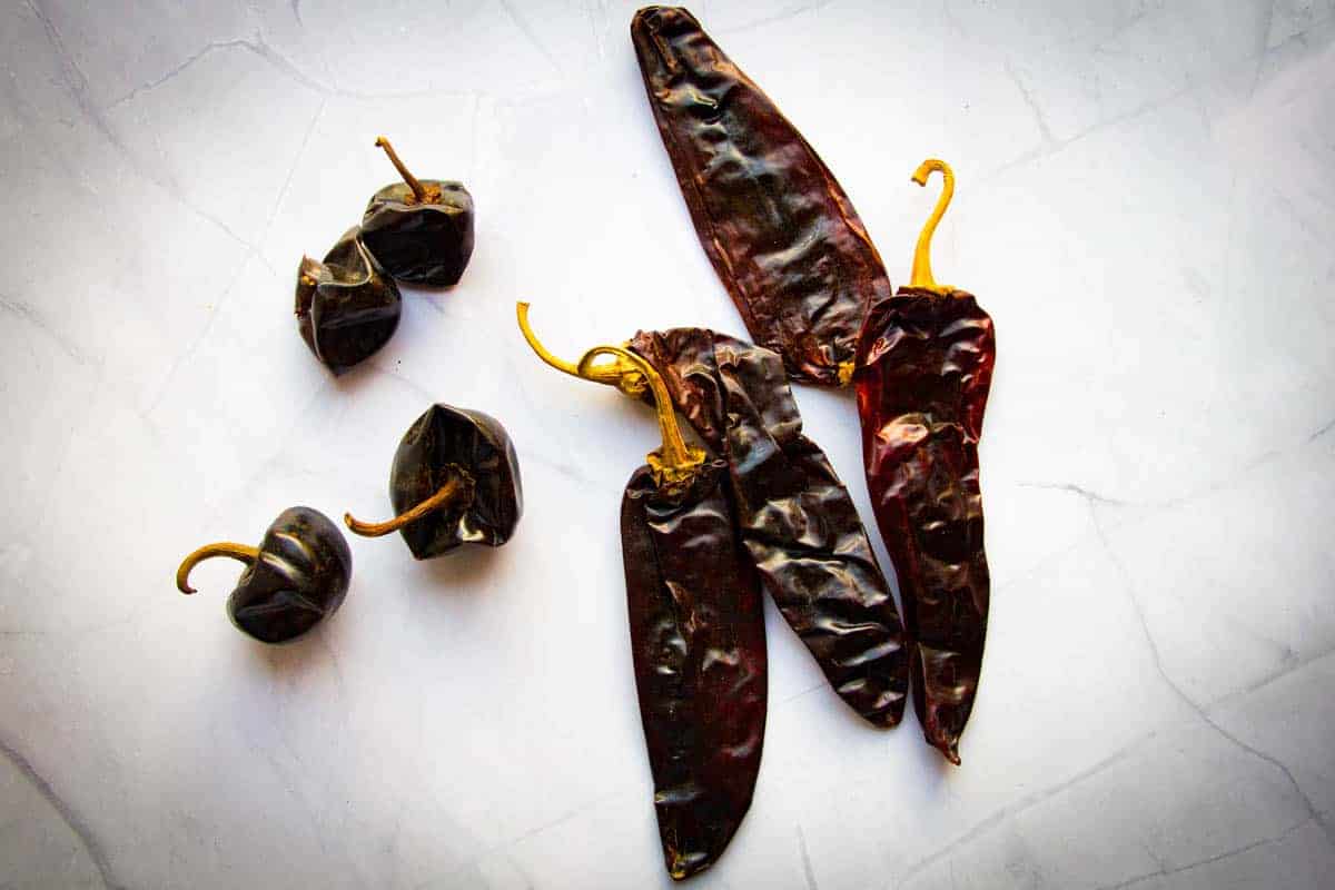 guajillo and cascabel peppers on the table. 