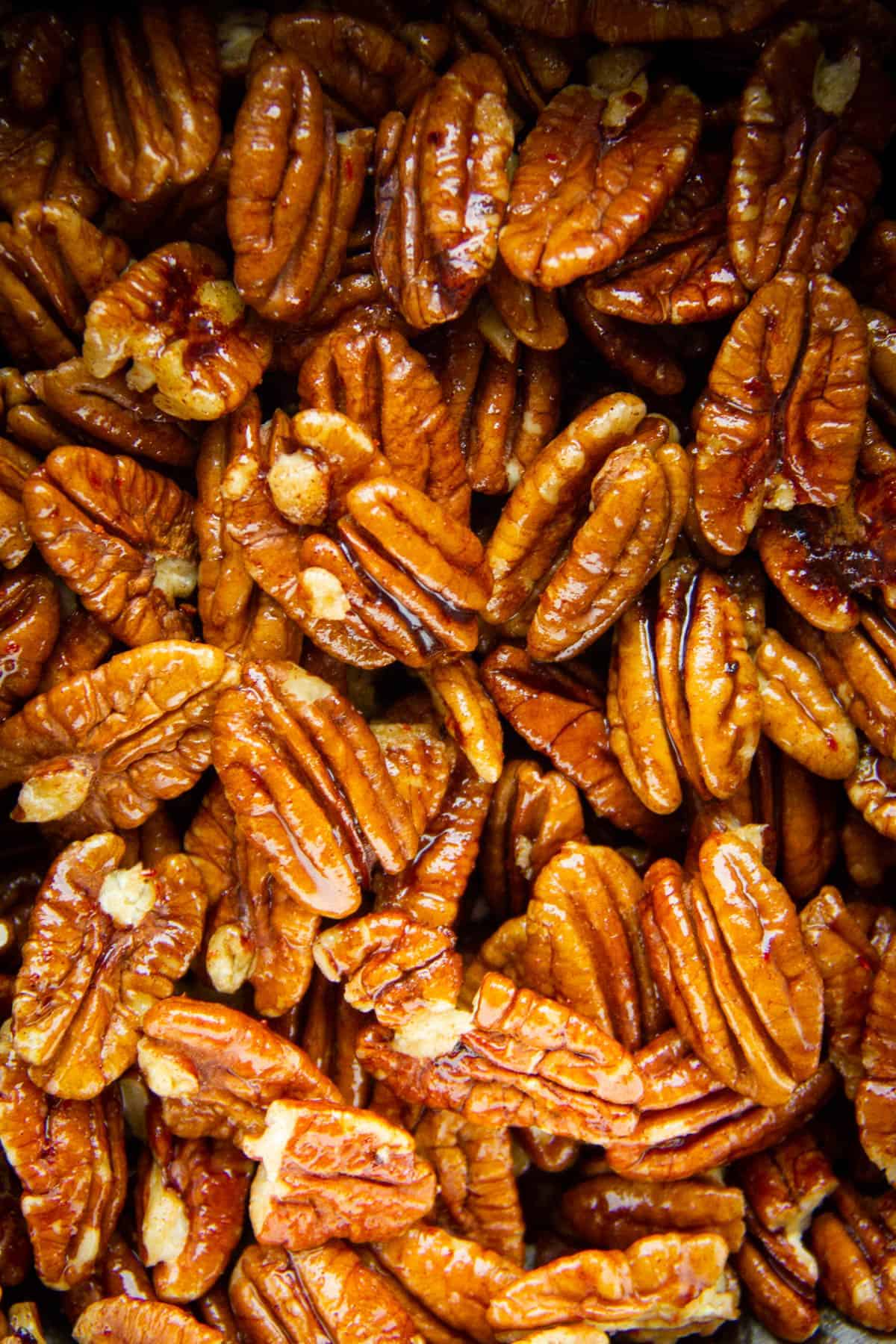 A close-up of a pecans on a tray.