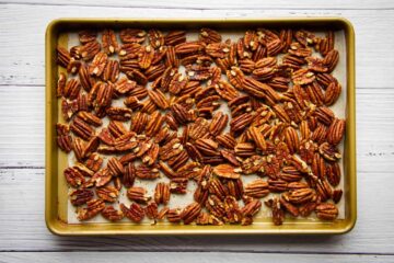 Pecan nuts on a tray ready to be baked
