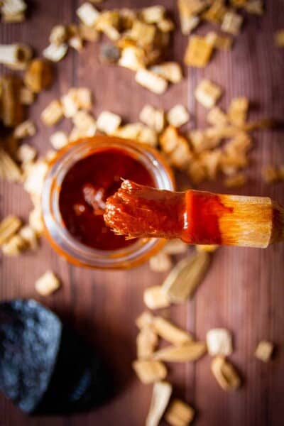 ancho bbq sauce on a brush.