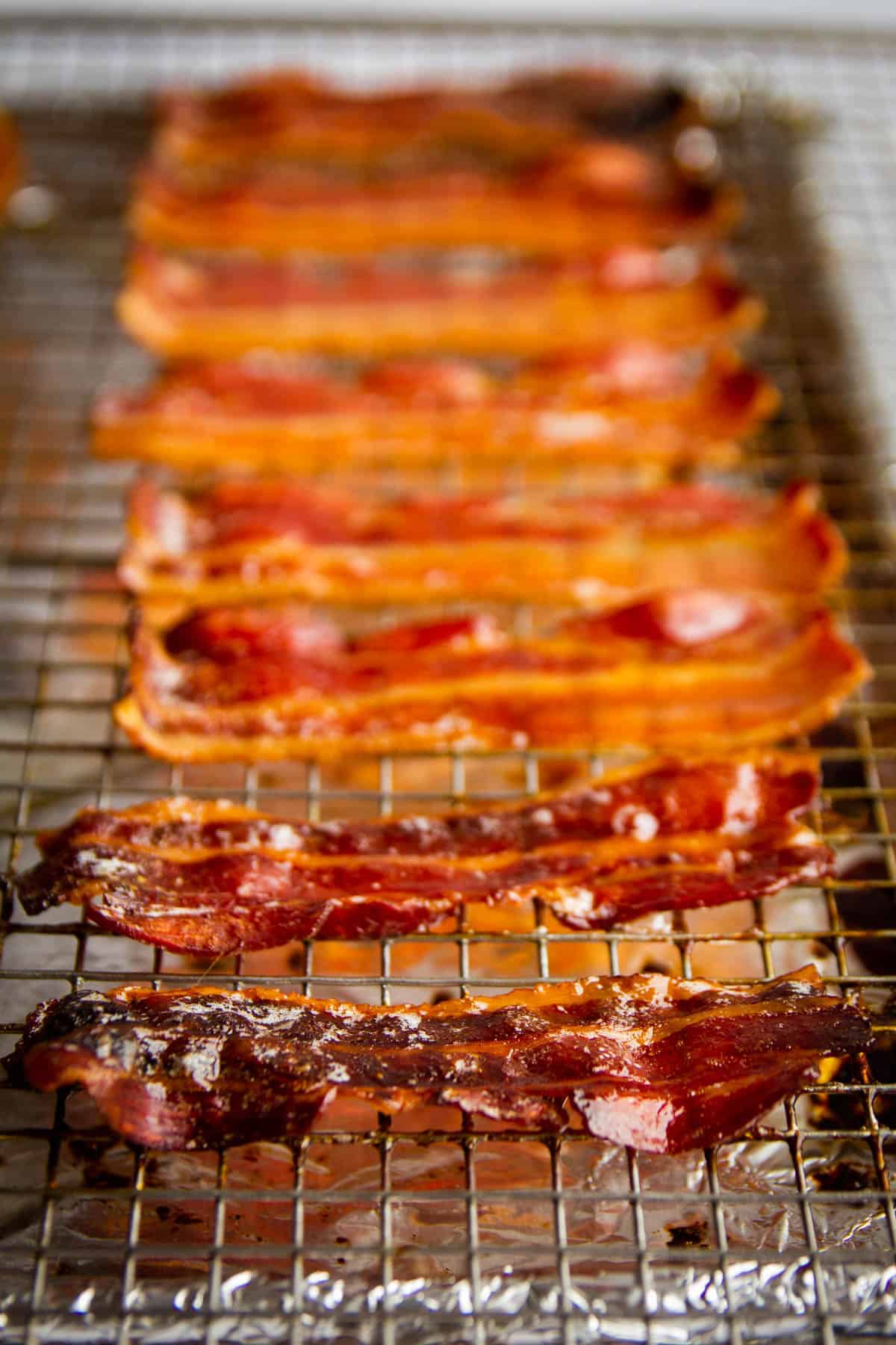 Crispy maple bacon lined up on a tray