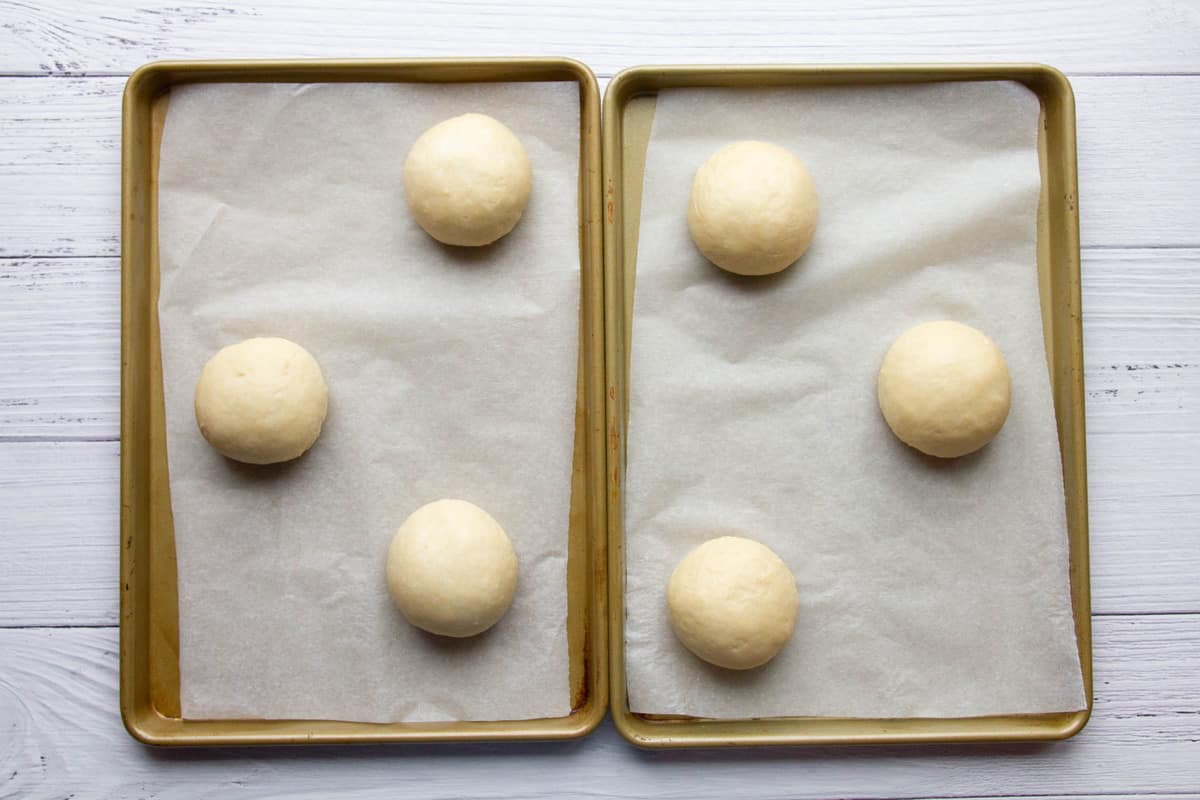 The dough shaped into balls on baking trays.