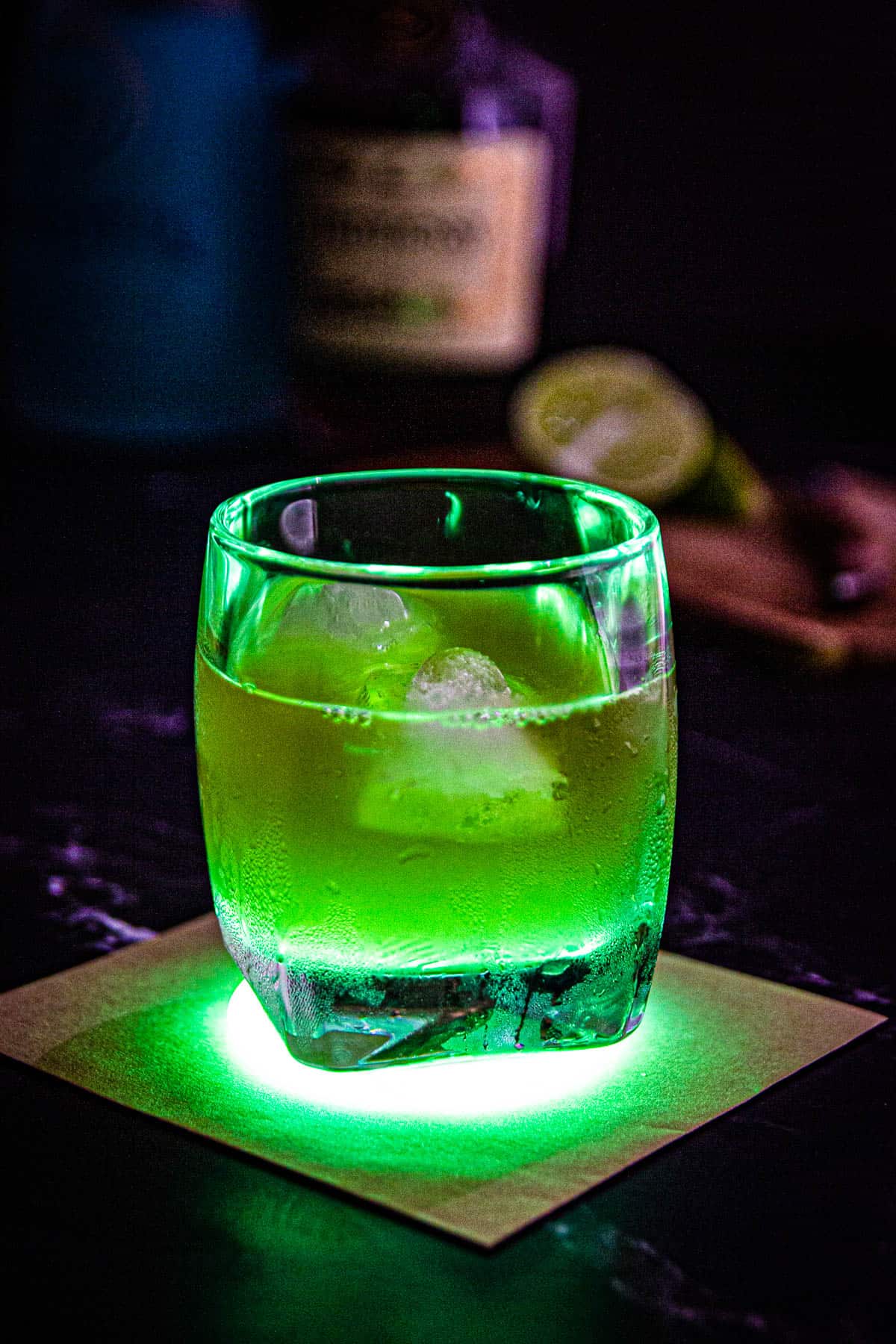 A glowing green incredible hulk drink cocktail.