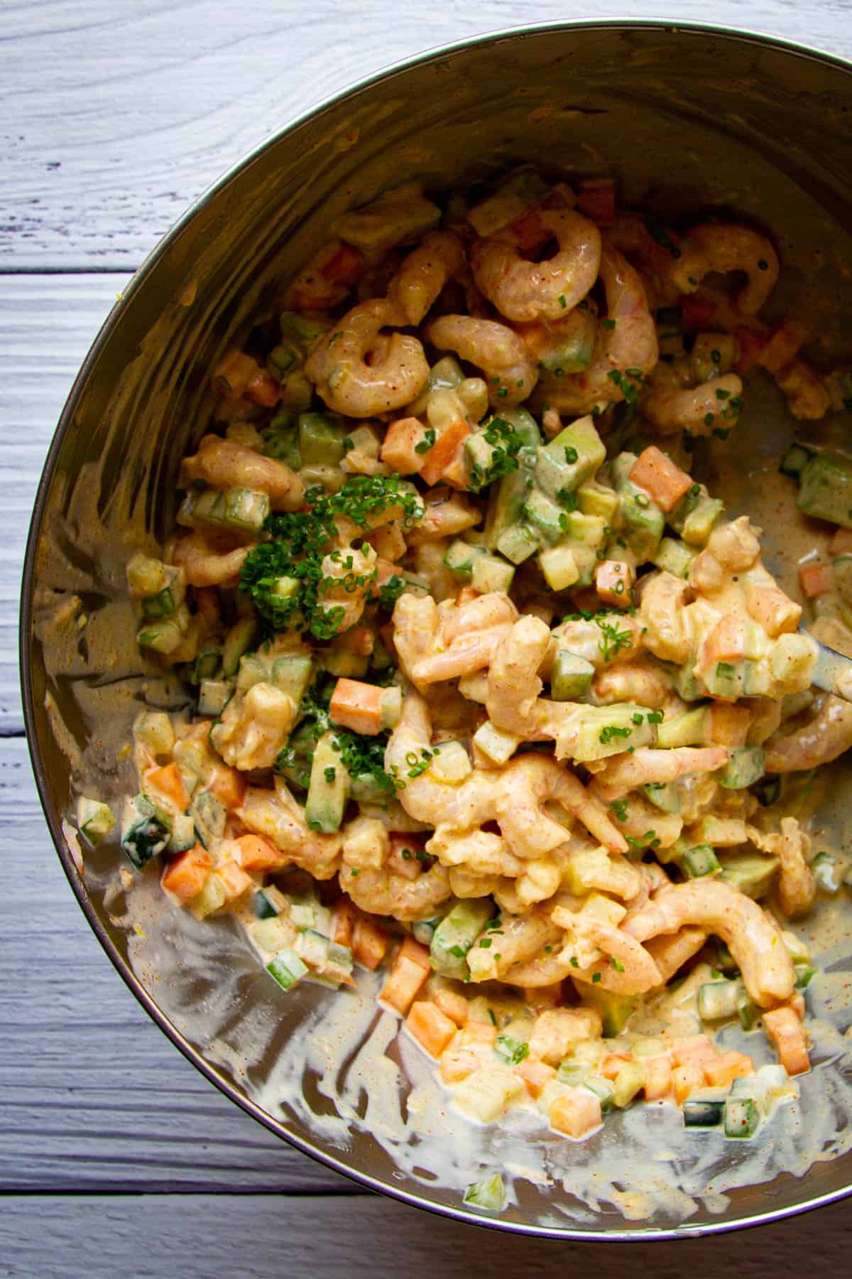 All of the ingredients for the shrimp salad mixed together.