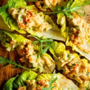 Another close up shot of the baby shrimp salad lettuce wraps on a board.