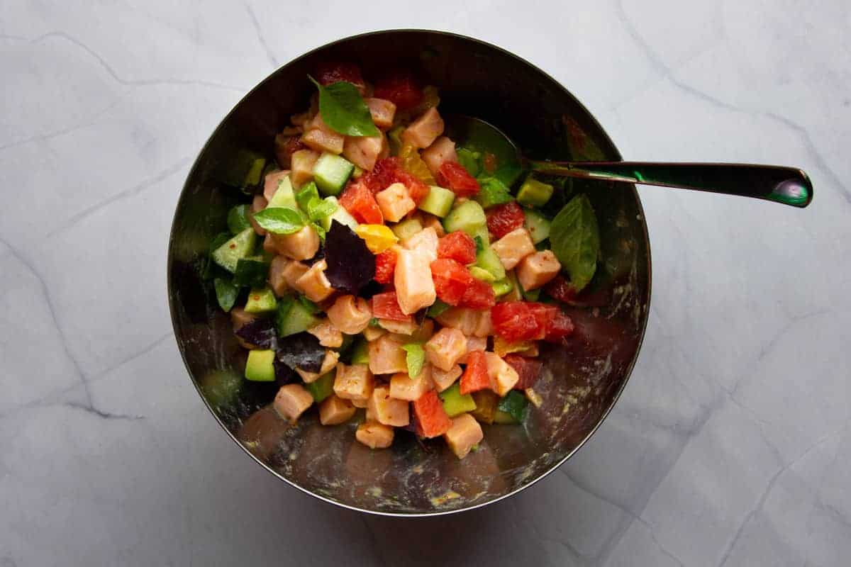 Mixing everything together for the salmon ceviche.