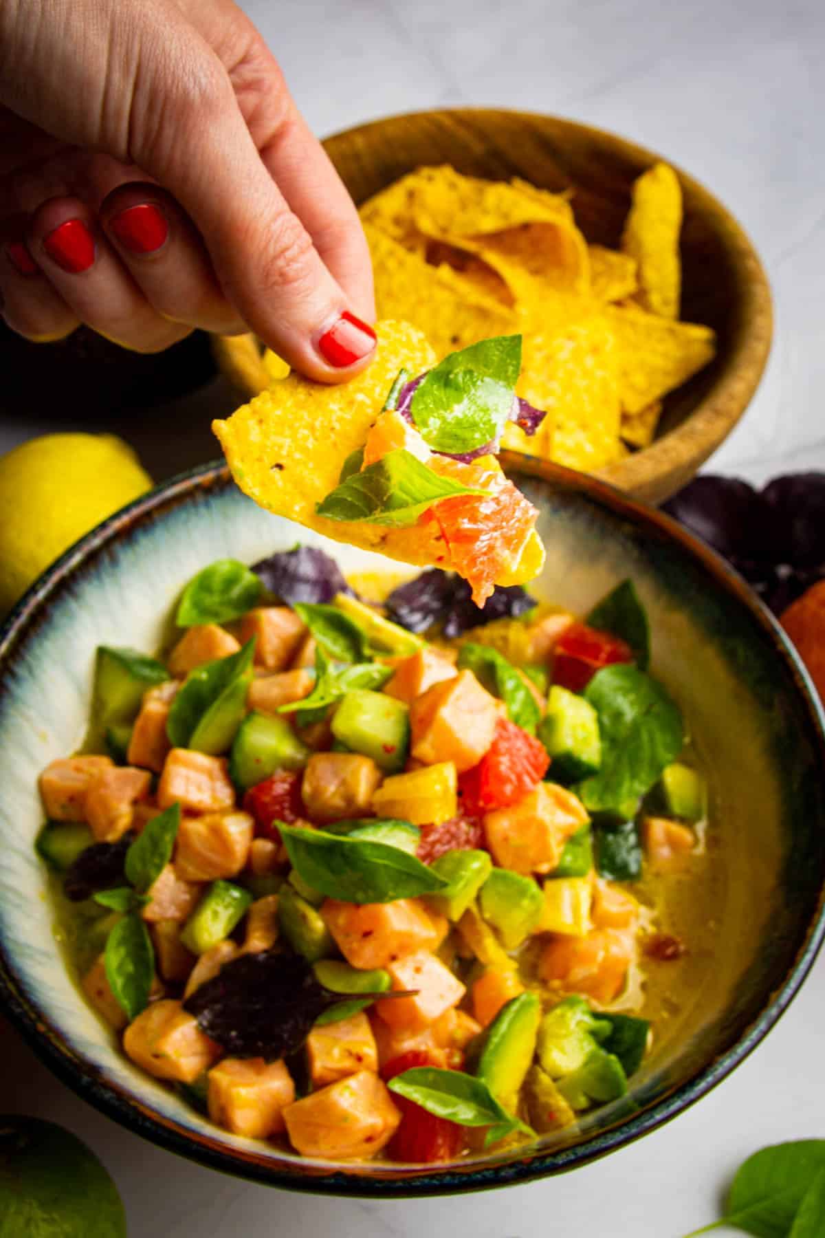 5 alive salmon ceviche with avocado, citrus, basil, cucumber and chili.