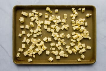 Cold cubed butter on a tray.