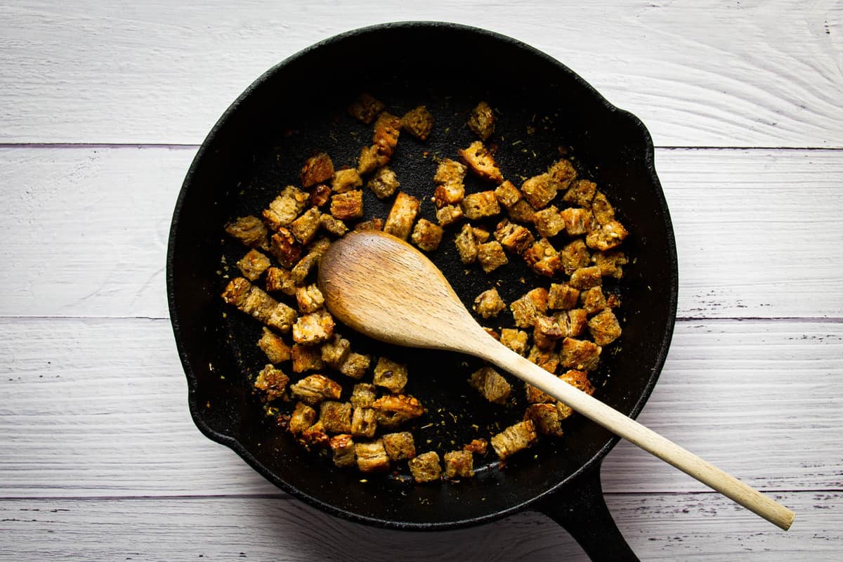 Cooking the croutons in the pan.