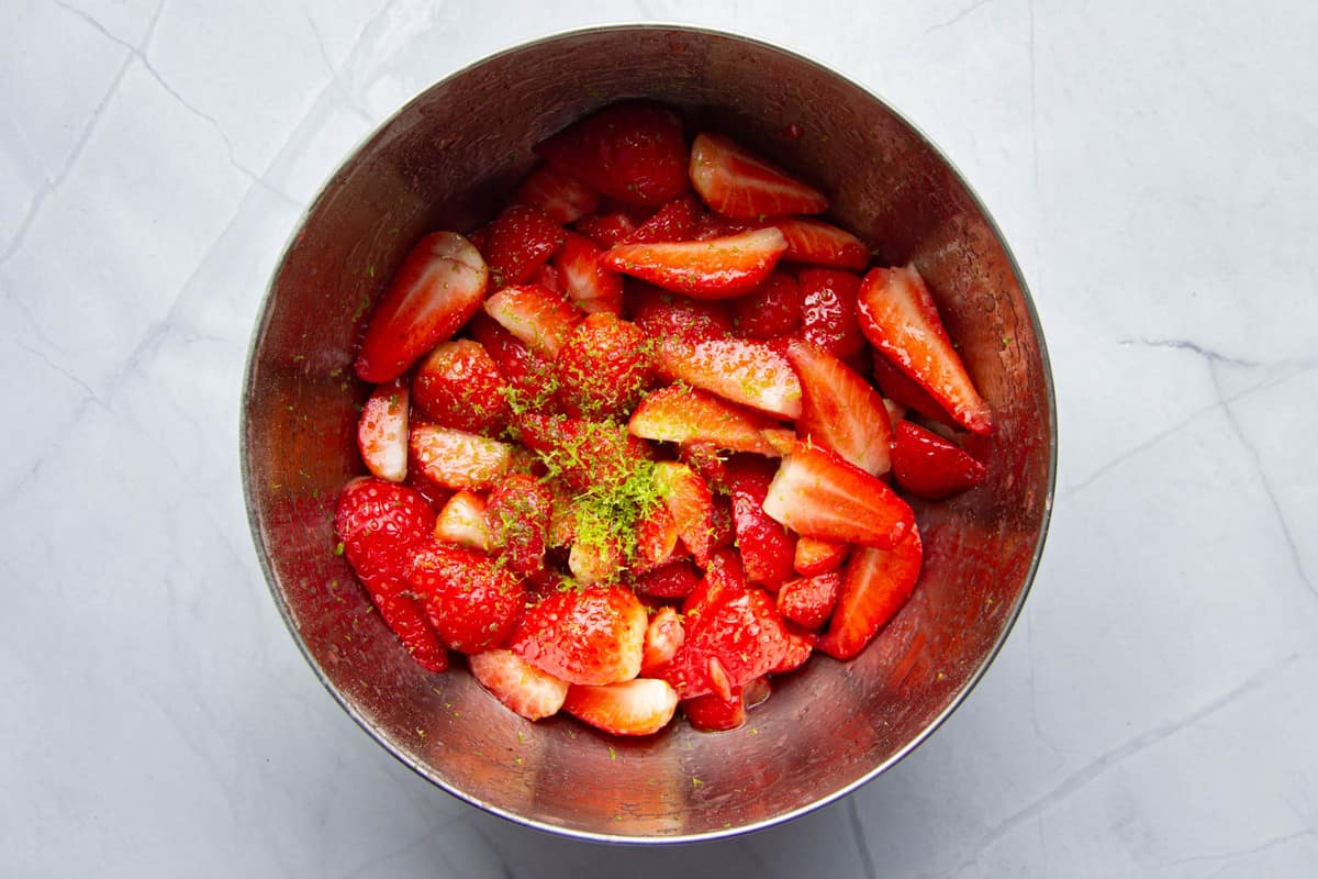 Curing the strawberries in sugar and lime.