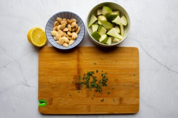 Pears, almonds, thyme and a lemon ready to go in separate bowls.