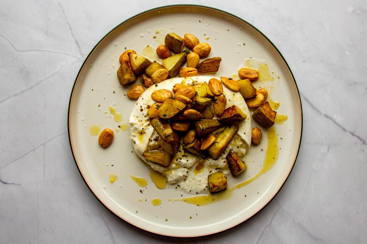 Burrata with roasted pears, browned butter, marcona almonds and fresh thyme.