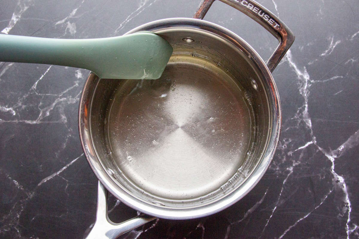 Combing the sugar and water in a small saucepan.