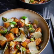 The pan fried gnocchi in a bowl.