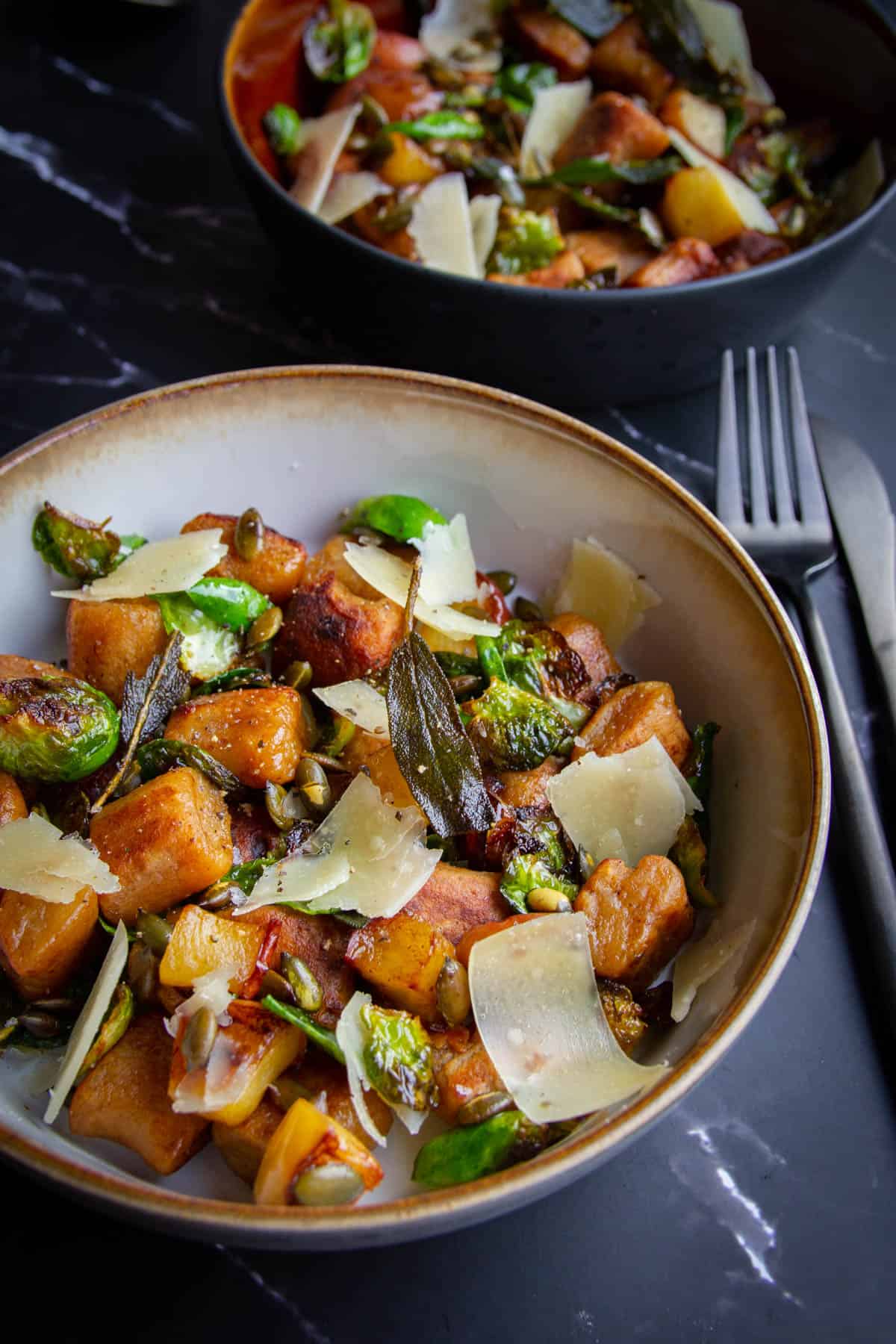 The pan fried gnocchi in a bowl.