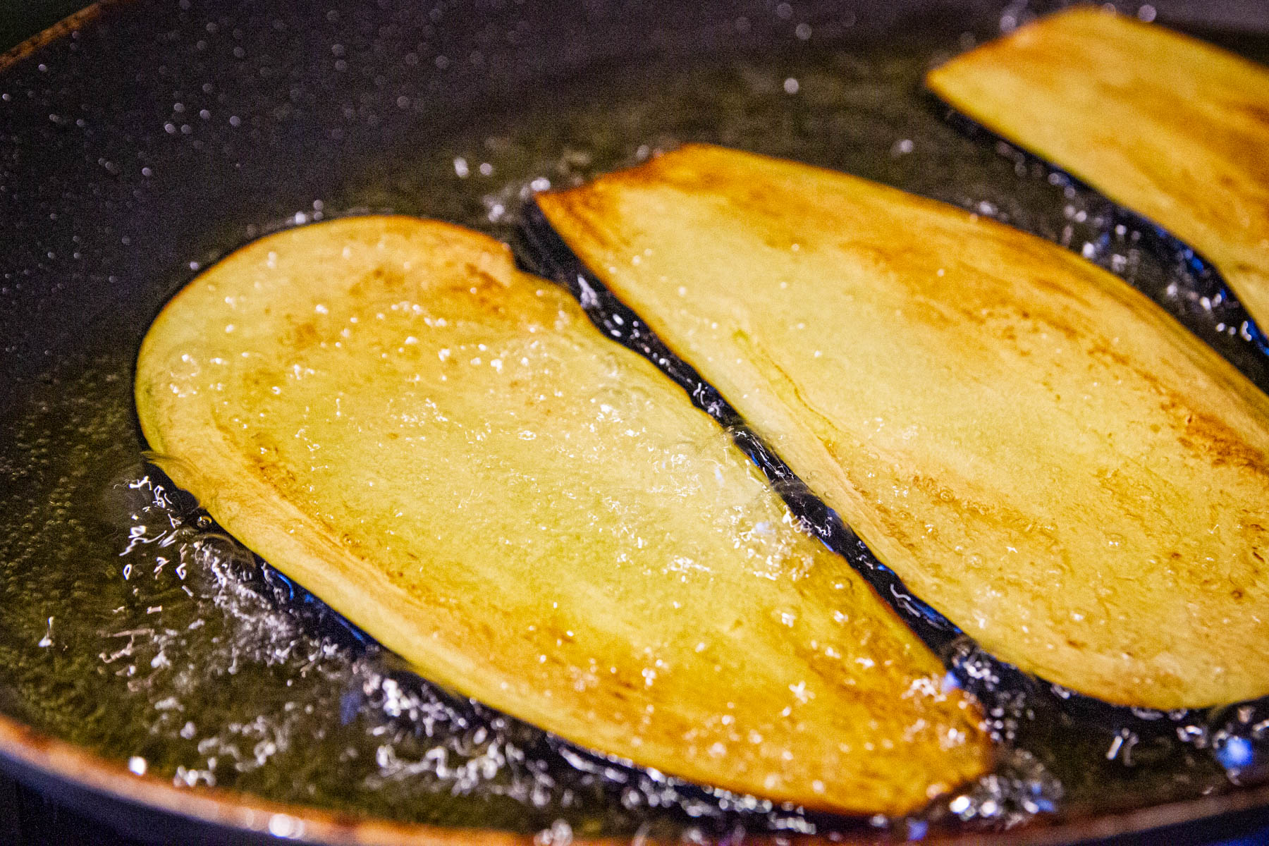 Frying the eggplant slices..