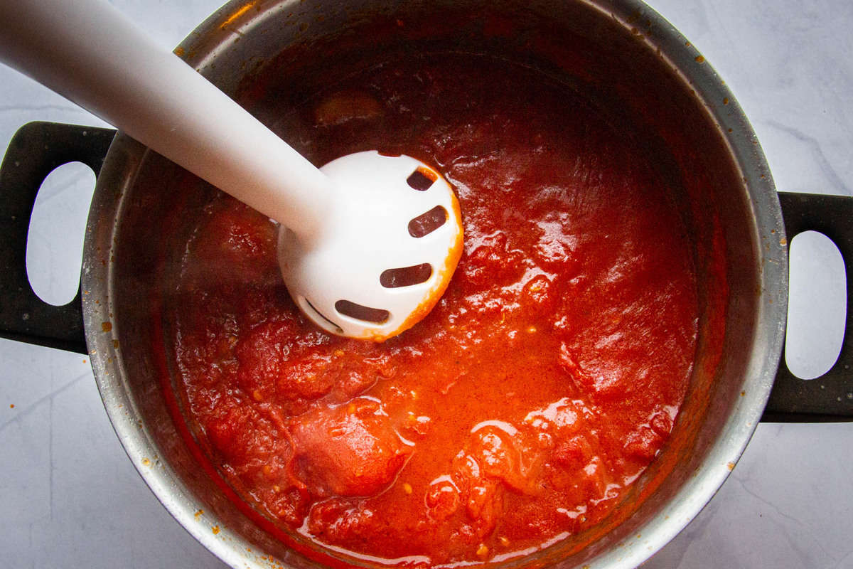 Pulsing the tomato sauce.