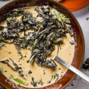 A bowl of black trumpet mushroom cream with tarragon.