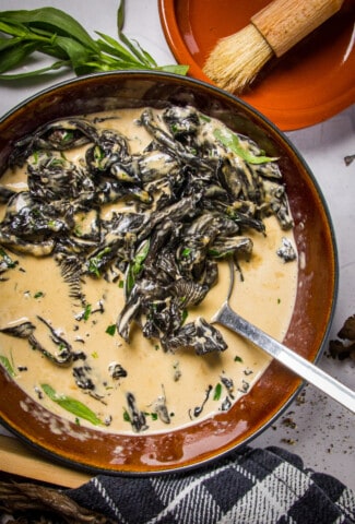 A bowl of black trumpet mushroom cream with tarragon.