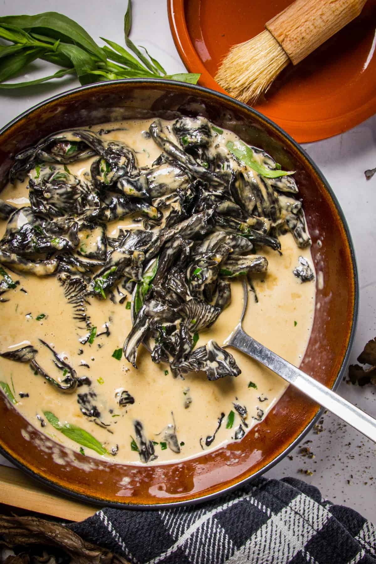 A bowl of black trumpet mushroom cream with tarragon.