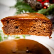 The ultimate keto sticky toffee pudding sitting high on a fork.