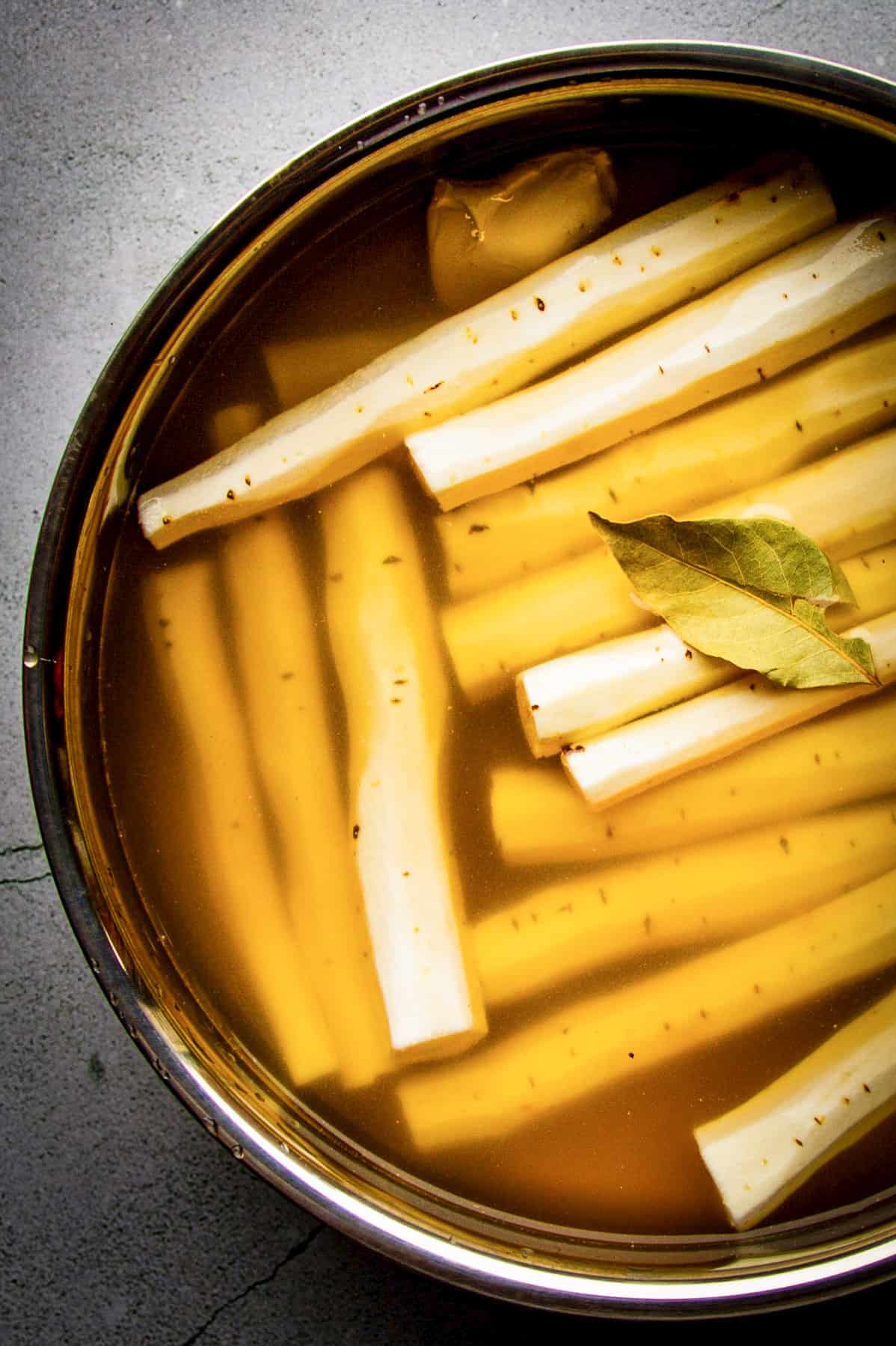 Braised black salsify in a pot.