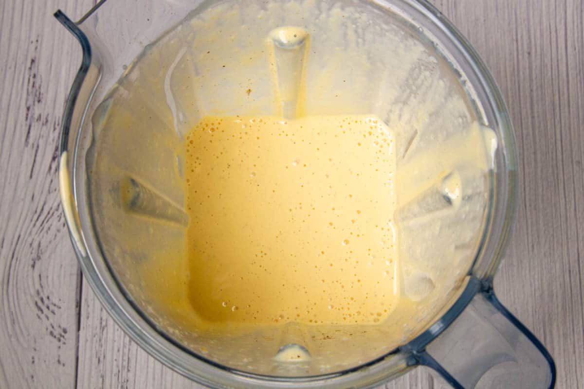 The cheese sauce in a blender jar.
