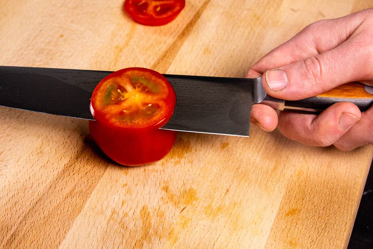 Slicing a tomato with the Suisin chef knife.